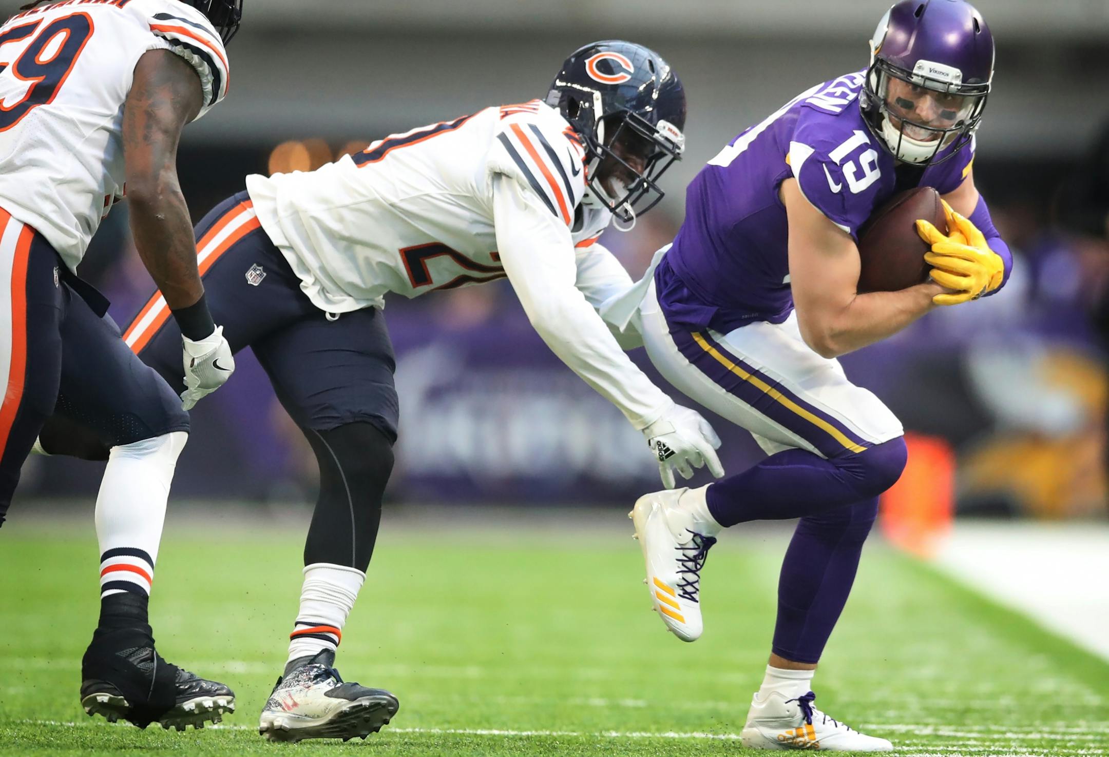 Minnesota Vikings wide receiver Adam Thielen (19) picked up a first down and was pushed out of bounds by Chicago Bears cornerback Prince Amukamara (20) at U.S. Bank Stadium Sunday December 31, 2017 in Minneapolis, MN.