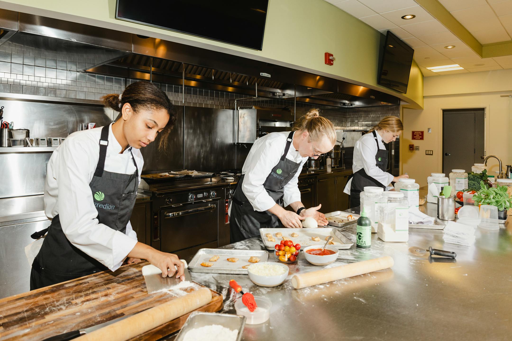 From left: Nia Bowdoin, Conner Thompson and Taylor May work in the kitchen at Ingredion in Bridgewater, N.J., Aug. 23, 2022. As supply chain delays and rising costs made individual ingredients harder to procure, food companies had to become very flexible. (Lanna Apisukh/The New York Times)