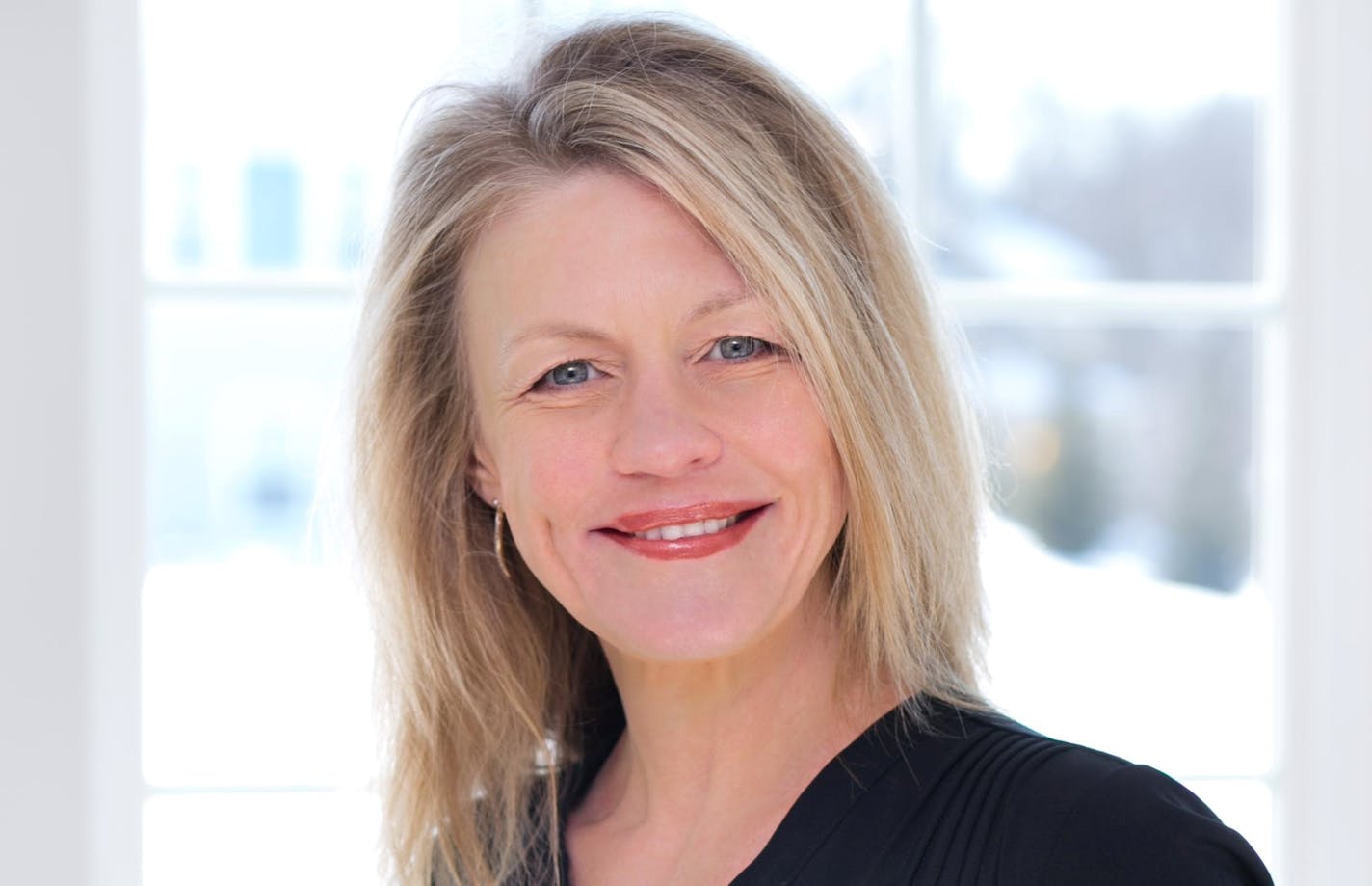 Portrait of Marianne Stebbins on white background.