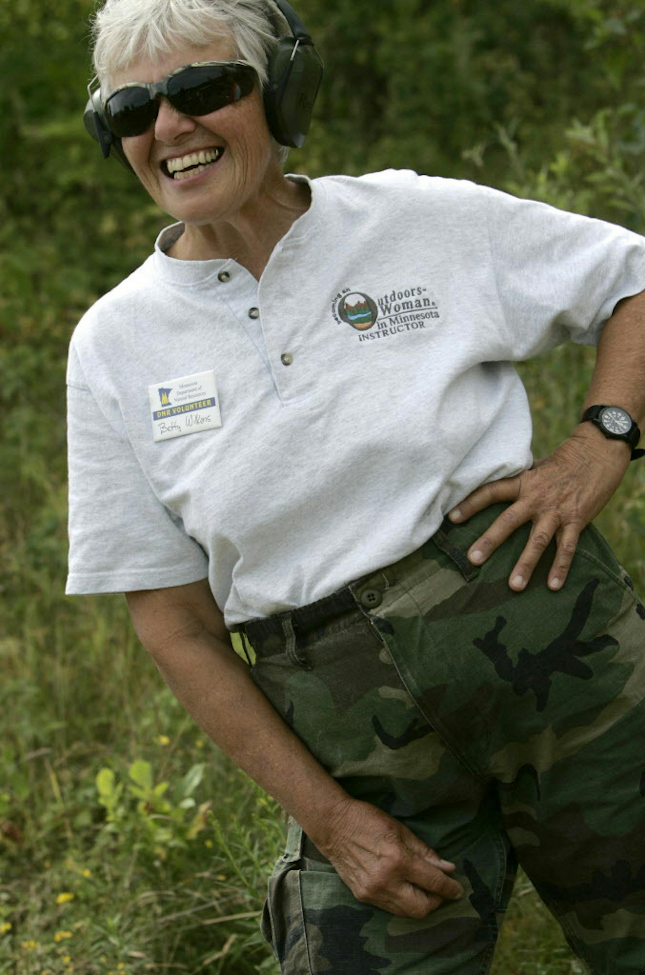 DAVID JOLES • djoles@startribune.com Mora, MN - Aug. 12, 2007 - Outdoors woman and volunteer instructor Betty Wilkens keeps an eye on shooters, some firing a rifle for their first time, during a Minnesota Chapter of Becoming an Outdoors Woman Program's first adult deer hunting clinic near Mora. ORG XMIT: MIN2016042613283333
