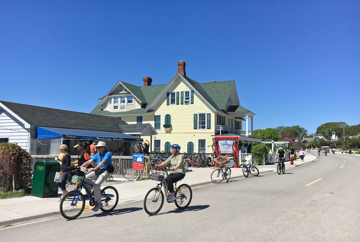 Visitors rode rental bikes past Mackinac Wheels, one of five rental shops on Mackinac Island in Lake Huron.