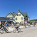 Visitors rode rental bikes past Mackinac Wheels, one of five rental shops on Mackinac Island in Lake Huron.