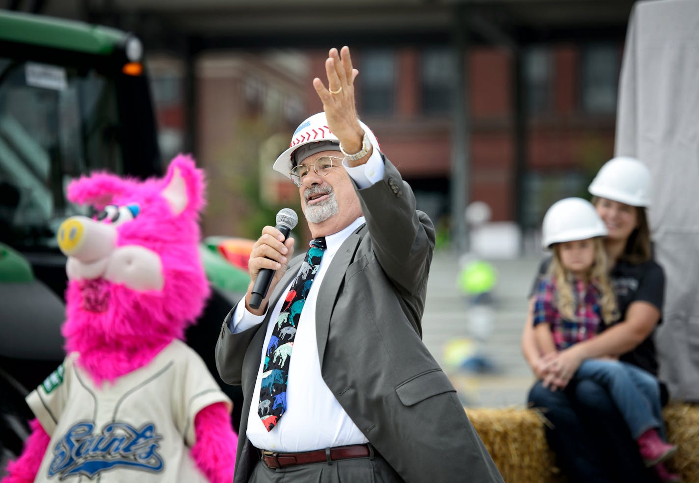 Saints president and owner Mike Veeck introduced CHS president Carl Casale. At a ceremony today at the stadium construction site, St. Paul and St. Paul Saints leaders announced the name of the new field will be CHS Field. CHS Inc is the nations leading farmer-owned cooperative and a global energy, grains and foods company. Team mascot Mudonna was also on hand with a band. ] St. Paul , MN -- , Monday, September 8, 2014. GLEN STUBBE * gstubbe@startribune.com