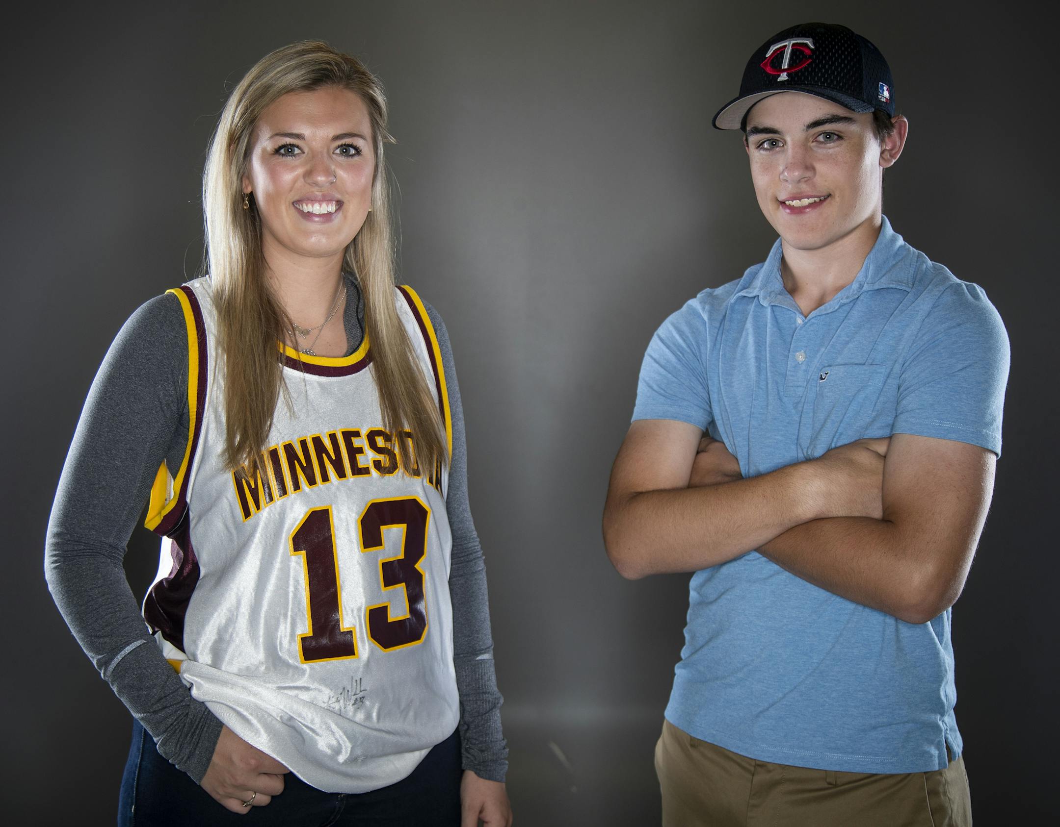 Lindsay Whalen fan Calleigh Carlson, left, and Joe Mauer fan Sam Petschel pose for a photo. ] LEILA NAVIDI ¥ leila.navidi@startribune.com BACKGROUND INFORMATION: Joe Mauer fan Sam Petschel and Lindsay Whalen fan Calleigh Carlson pose for a photo at the Star Tribune photo studio in Minneapolis on Wednesday, June 5, 2019. For a Chip column on Whalen and Mauer jersey retirements.