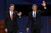 Republican presidential nominee Mitt Romney and President Barack Obama wave to the audience during the first presidential debate at the University of 