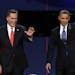 Republican presidential nominee Mitt Romney and President Barack Obama wave to the audience during the first presidential debate at the University of 
