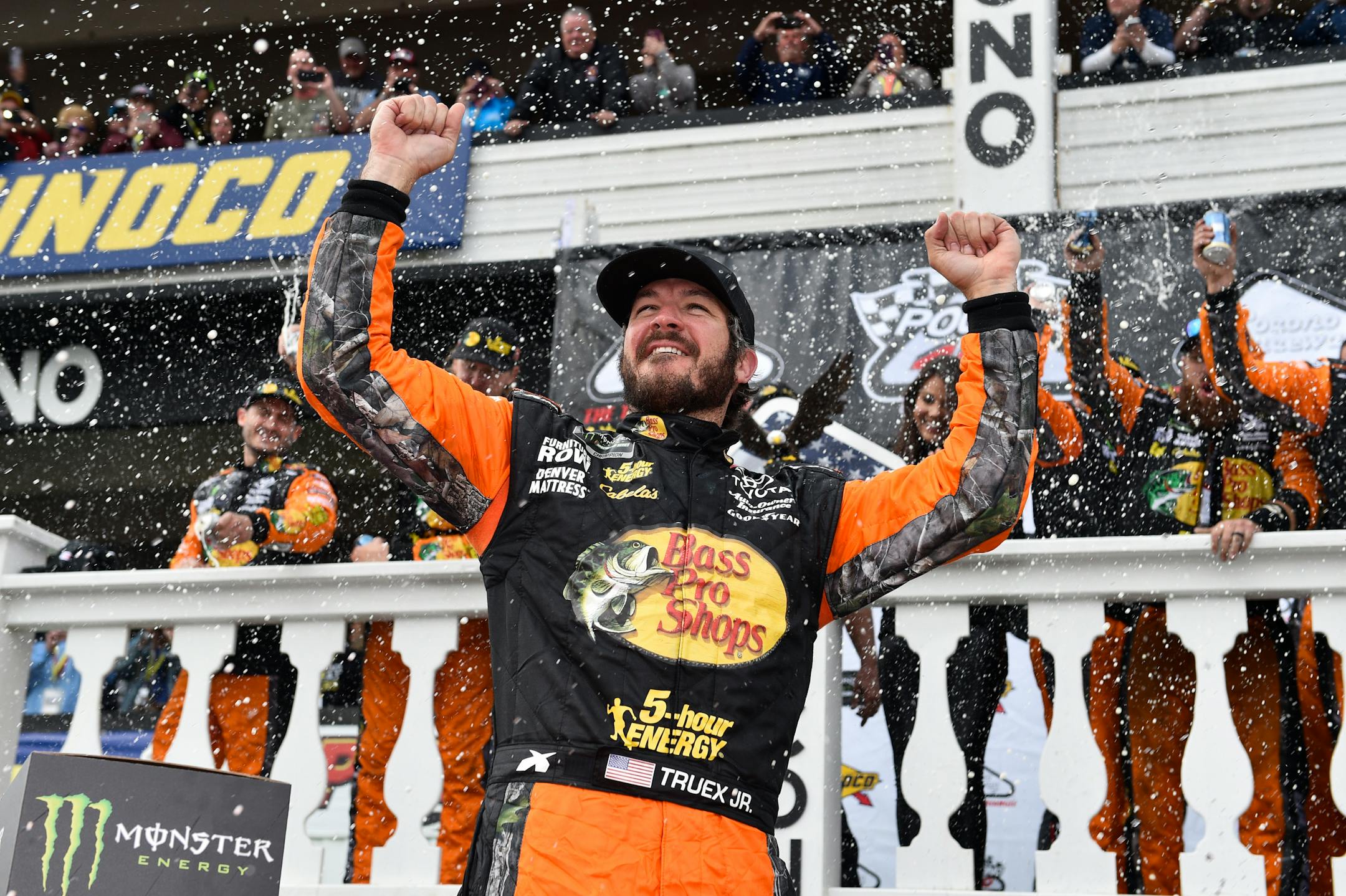 Martin Truex Jr. celebrated in Victory Lane after winning the NASCAR Cup race at Pocono Raceway on Sunday in Long Pond, Pa.