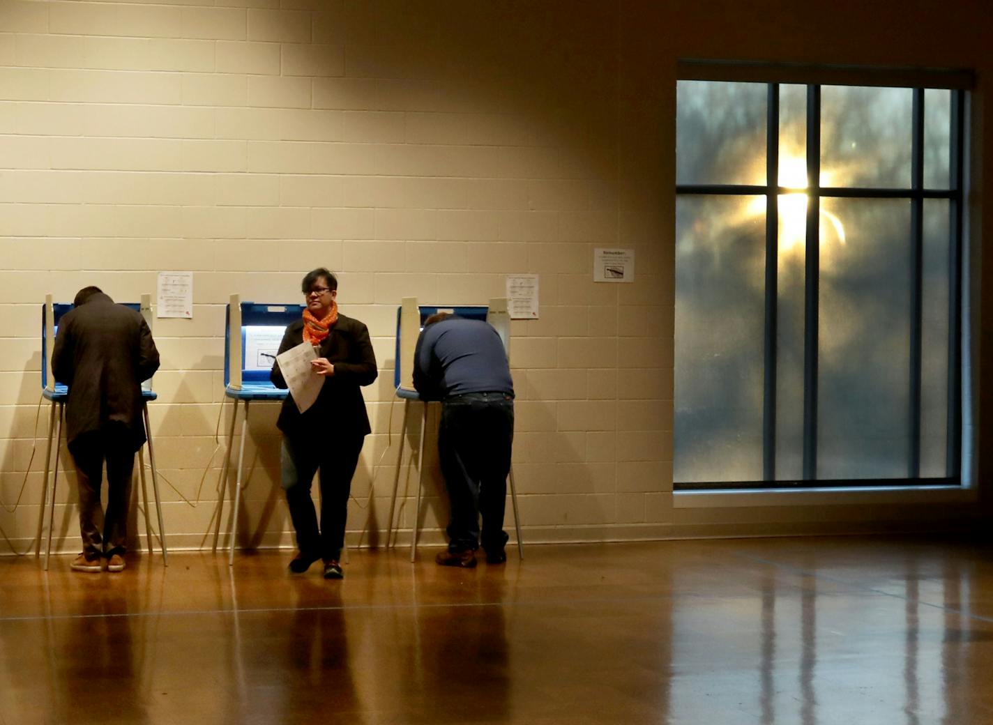 Voters cast their ballots Tuesday at the Arlington Hills Community Center in St. Paul, where a question about the city's organized trash collection as well as City Council and school board races were up for consideration.