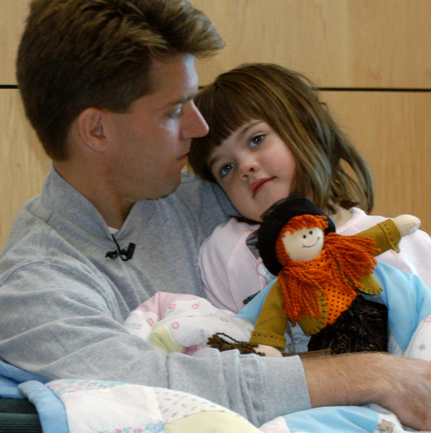 St. Paul, September 16, 2003 - Toby Pearson holds his 4-year-old daughter Grace at a press conference at Regions Hospital. ORG XMIT: MIN2014041810565304