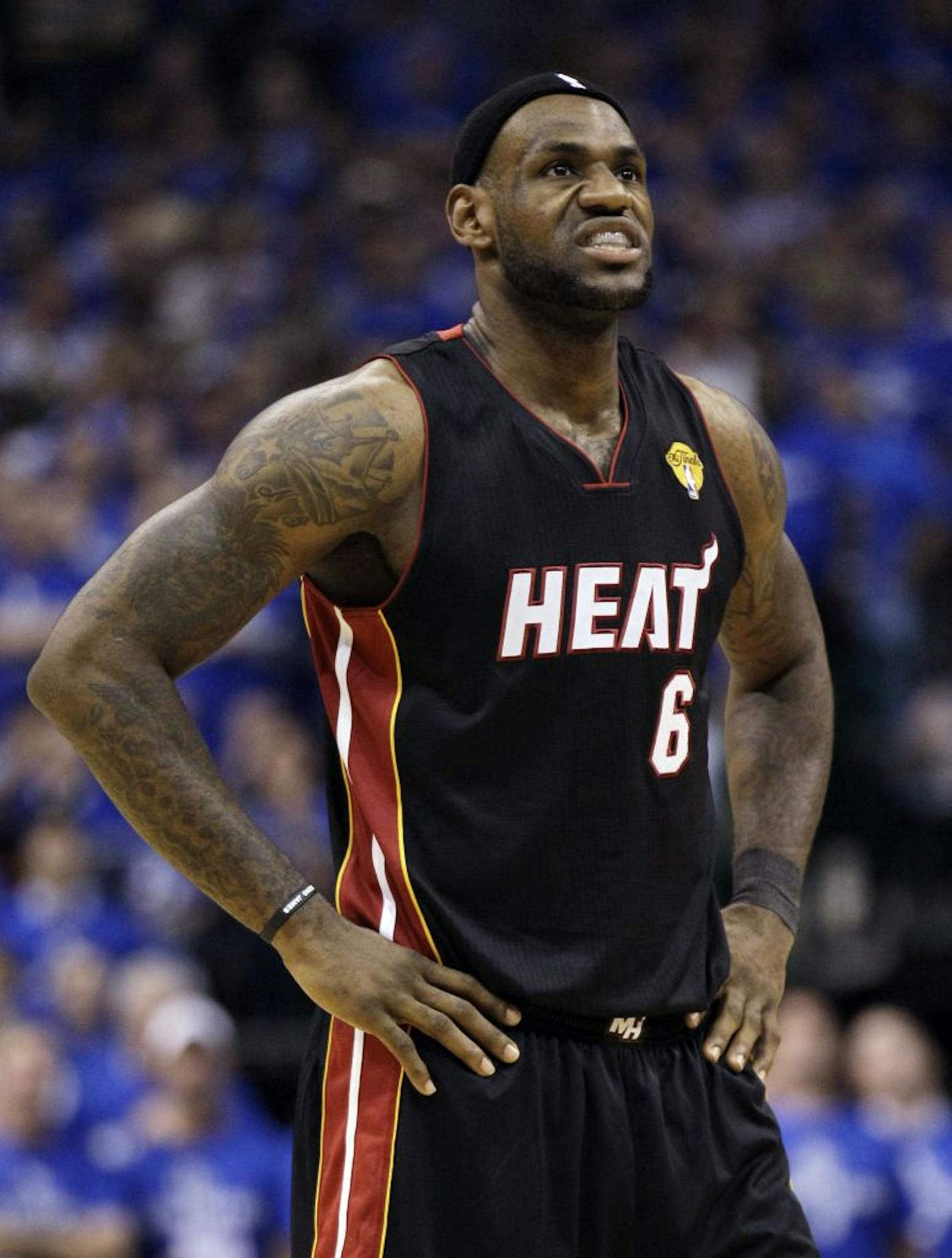 Miami Heat's LeBron James reacts during the first half of Game 5 of the NBA Finals basketball game against the Dallas Mavericks Thursday, June 9, 2011, in Dallas.