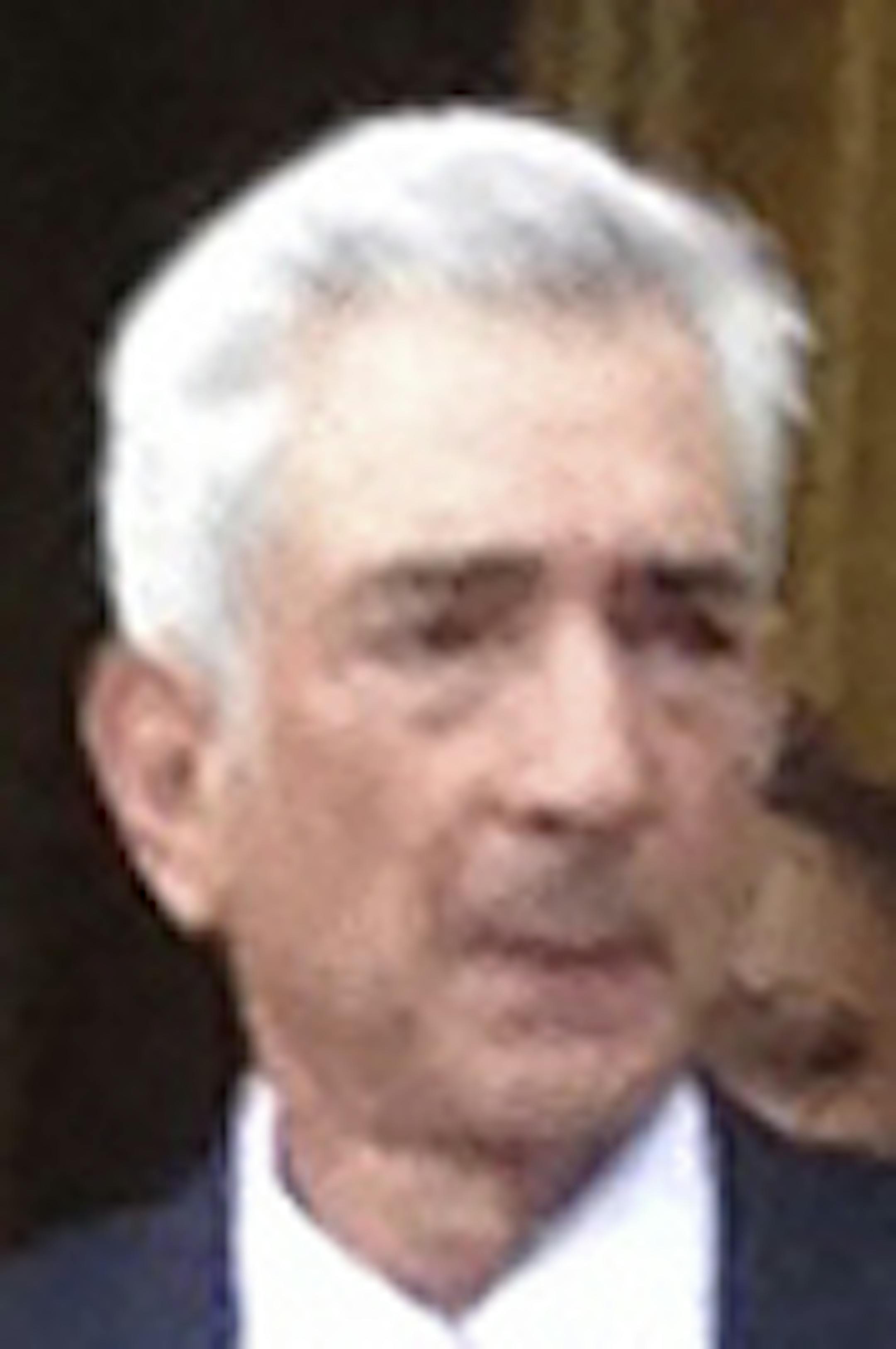 Judge Richard M. Berman, center, briefly stops out of a federal courthouse in New York, Wednesday, Aug. 12, 2015, after the first hearing in the civil suit that New England Patriots quarterback Tom Brady filed against the NFL in an attempt to get his four-game suspension lifted. During the proceedings, Brennan repeatedly asked NFL lawyer Daniel L. Nash about whether evidence exists that directly links Brady to deflating the footballs used during the AFC championship game Jan. 18, 2015. (AP Photo