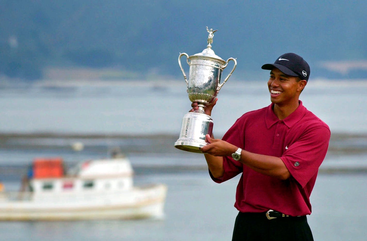 Tiger Woods holds the trophy after capturing the 100th U.S. Open at Pebble Beach in June of 2000