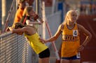 Third-place finisher Abbey Nechanicky of Wayzata congratulated winner Analee Weaver of Stillwater after the Class 2A 3,200-meter championship race in 