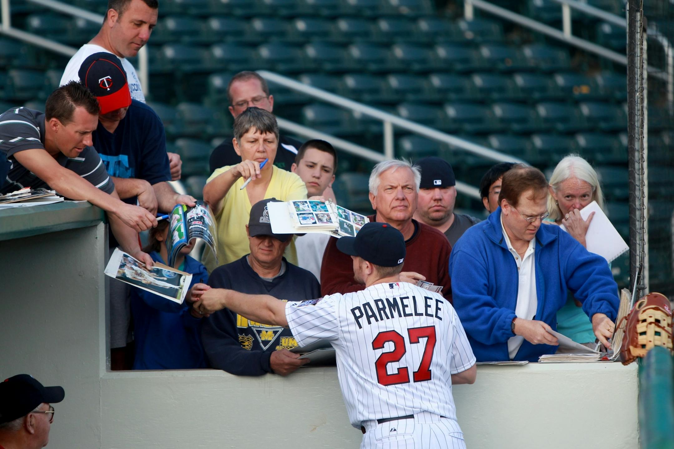Minnesota Twin Chris Parmalee treated fans to autographs after he posed for photos during media day, Monday, February 27, 2012 in Ft. Myers, FL.