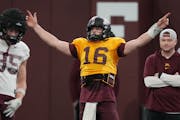 Gophers quarterback Max Brosmer, a transfer from New Hampshire, directs players during practice Thursday.