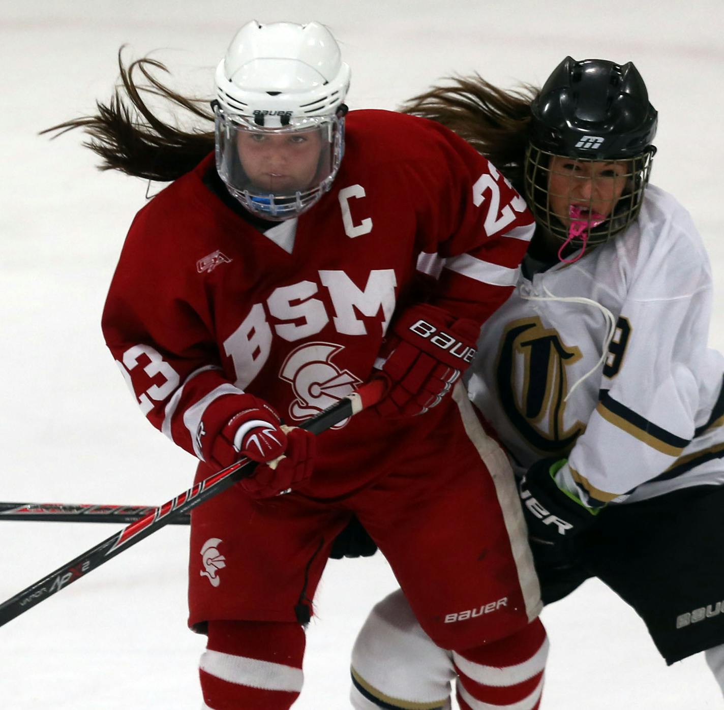 Benilde-St. Margaret's Brittany Wheeler and Chaske/ Chanhassen's Sydney Kaye went after the puck during the Mid-Winter Meltdown tournament semifinals in Eden Prairie Friday, December 27, 2013. ] (KYNDELL HARKNESS/STAR TRIBUNE) kyndell.harkness@startribune.com