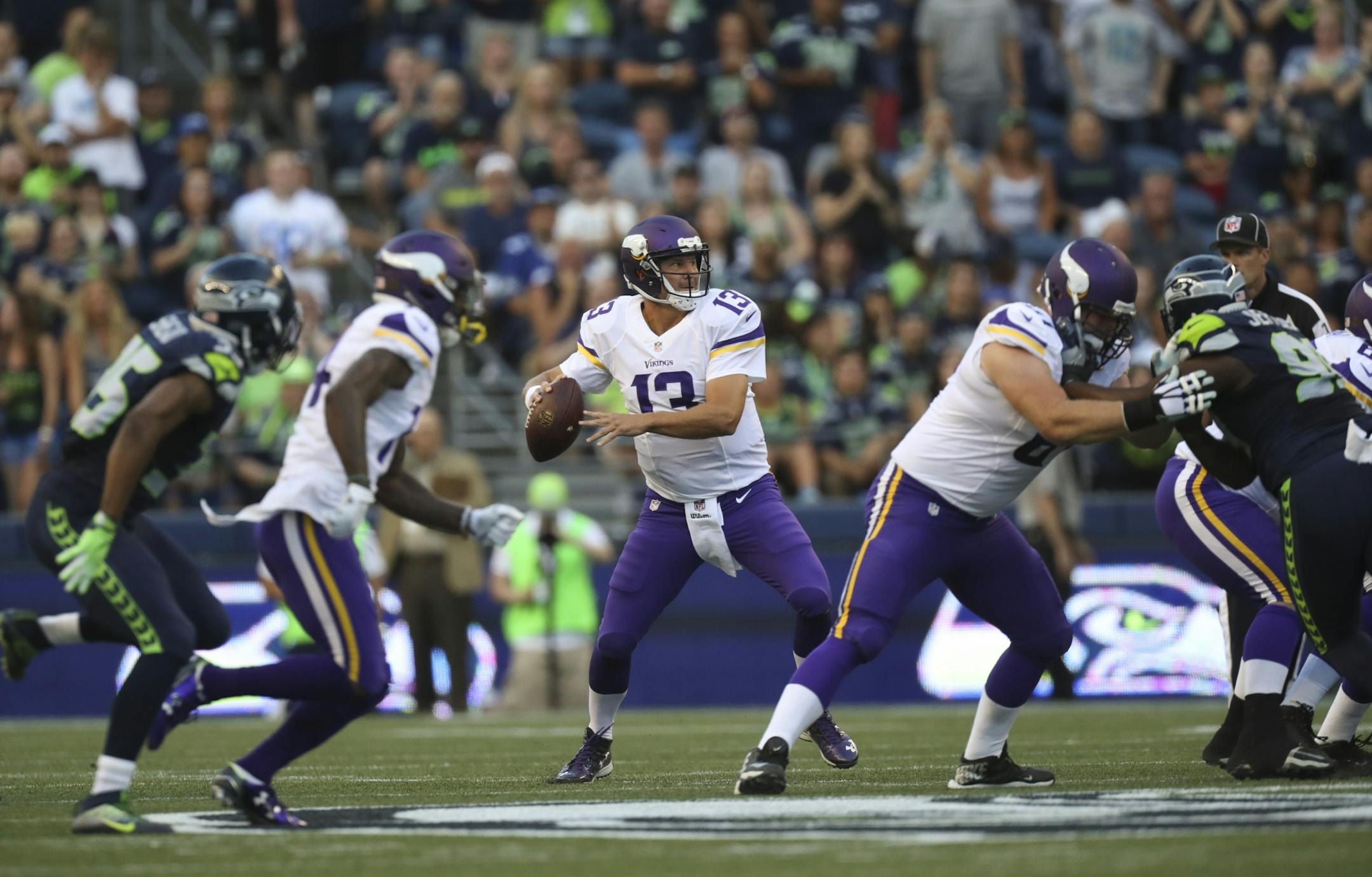 Vikings quarterback Shaun Hill (13) dropped back to throw on the Vikings' first drive in the first quarter Thursday night.