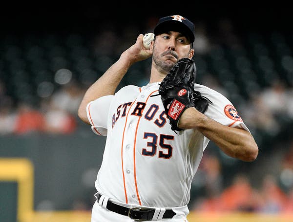 Houston Astros starting pitcher Justin Verlander delivers during the first inning of a baseball game against the Minnesota Twins, Wednesday, April 24,