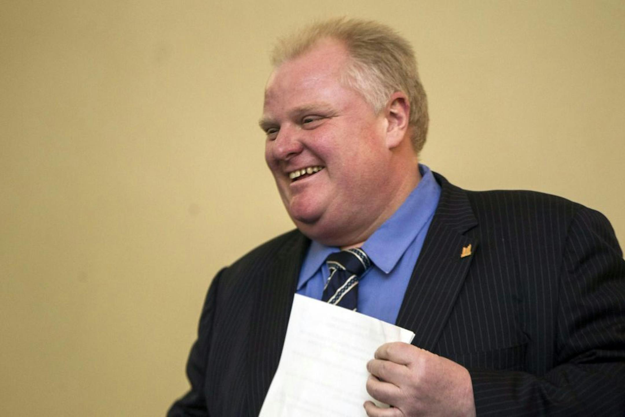 FILE - In this Tuesday, Dec. 10, 2013, file photo, Toronto Mayor Rob Ford arrives for a news conference at City Hall in Toronto.