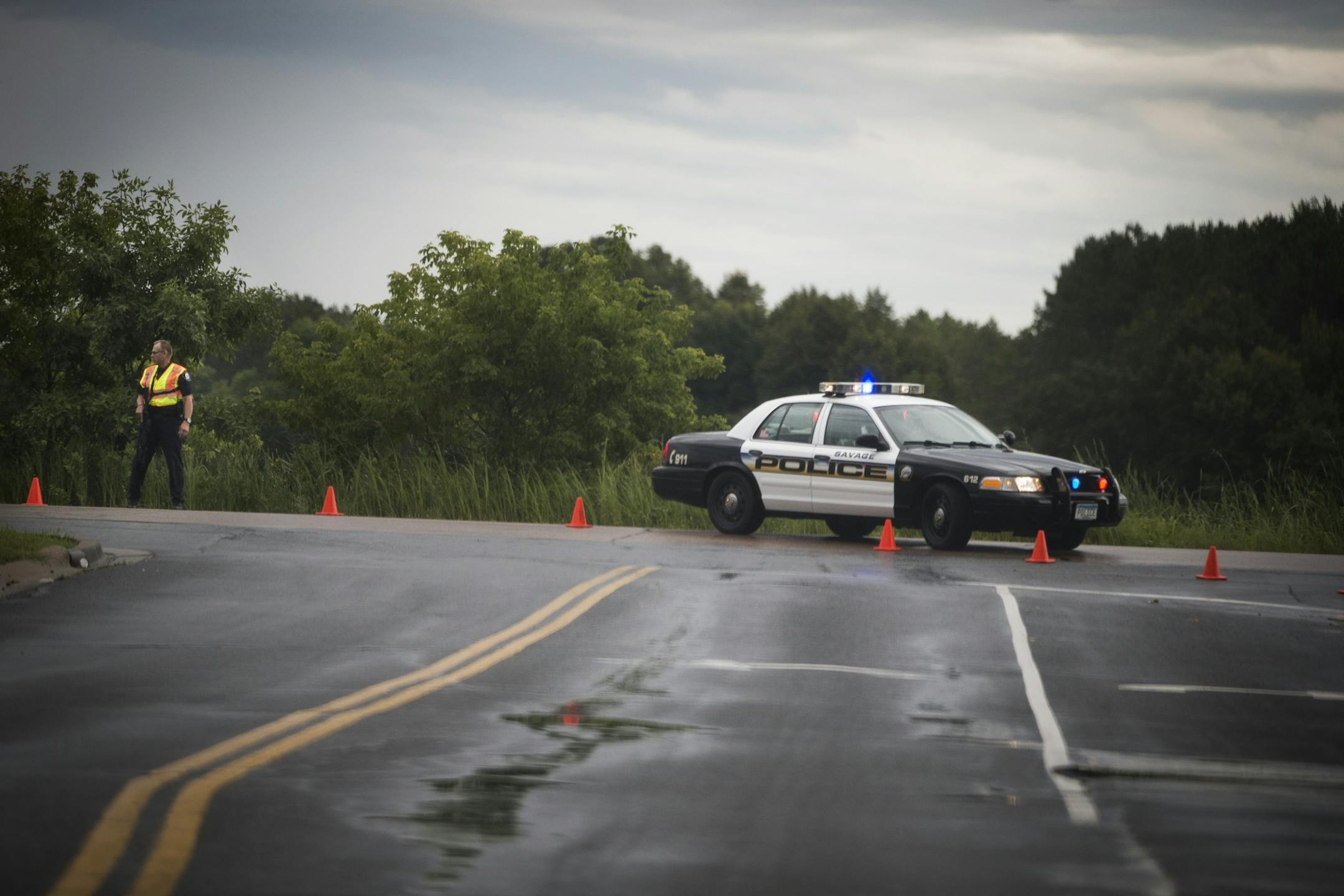An armed police officer stood at the blocked off road to Mystic Lake Casino in Shakopee on Wednesday, September 3, 2014.