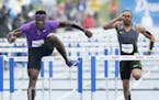 Omar McLeod, center, clears the final hurdle as he wins the men's special 110-meter hurdles at the Drake Relays athletics meet, Saturday, April 30, 20