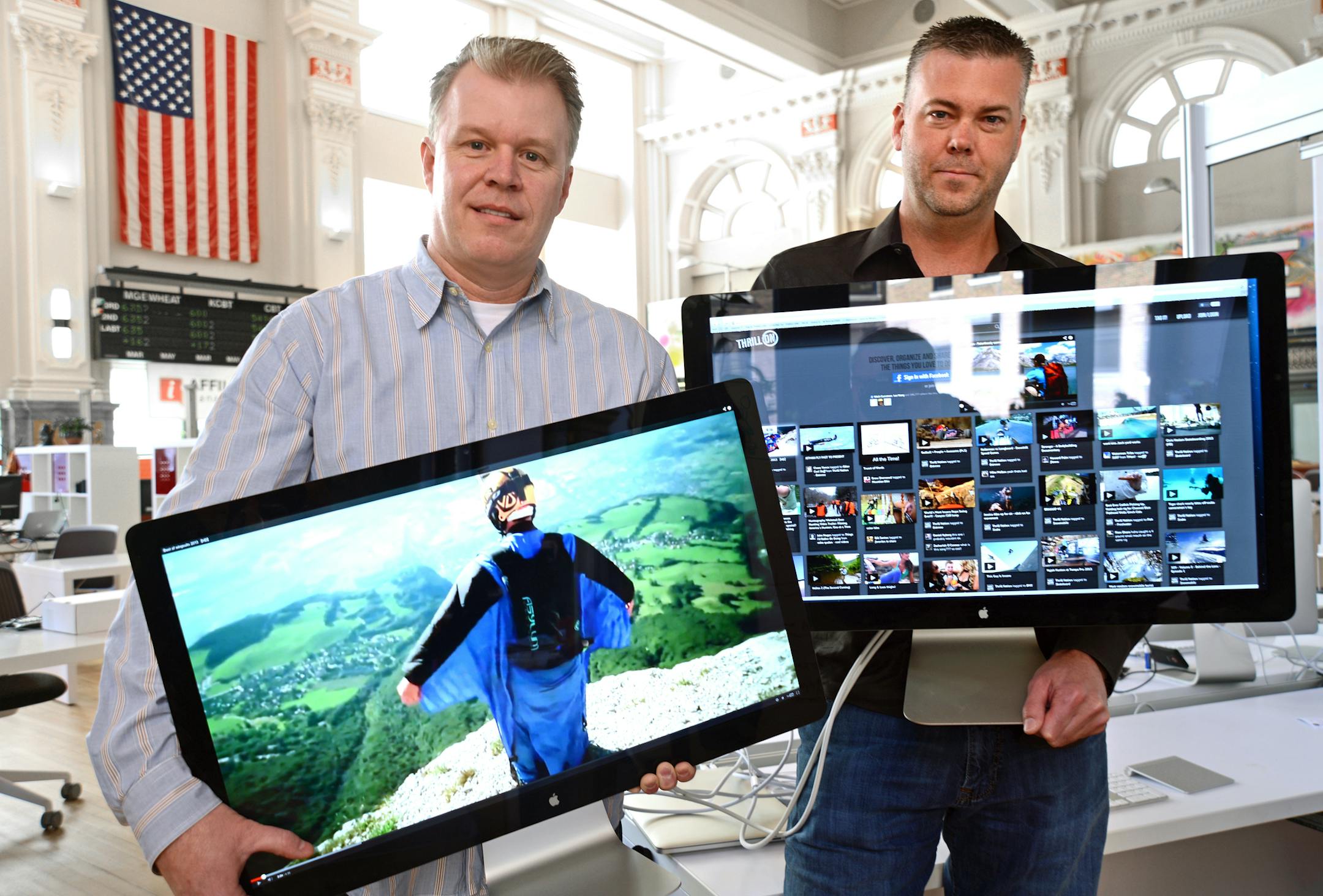 ThrillOn is a new social media platform with a focus on outdoor adventure like snowboarding, biking, etc. ThrillOn bases out of CoCo at the Grain Exchange Building in Minneapolis. Brian Howe and Shayne Mitchell founders hold video monitors featuring some of the sites at ThrillOn. ] Richard.Sennott@startribune.com Richard Sennott/Star Tribune. , Minneapolis Minn. Wednesday 4/3/13) ** (cq) ORG XMIT: MIN1304031311024796