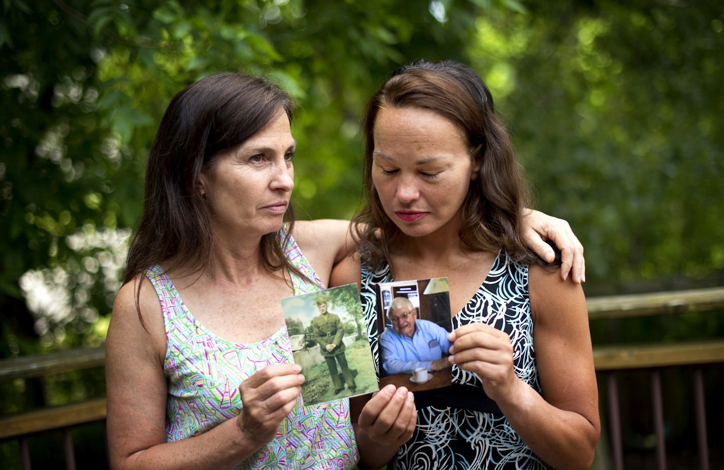 Mary Crispin and Diane Restrepo held photos of their father Donald Crispin as they talked about how they didn't want their father's legacy to be that he was swindled by Steven Miller and Marina Lahara but for the good, brave man he was. Friday, June 21, 2013 ] GLEN STUBBE * gstubbe@startribune.com