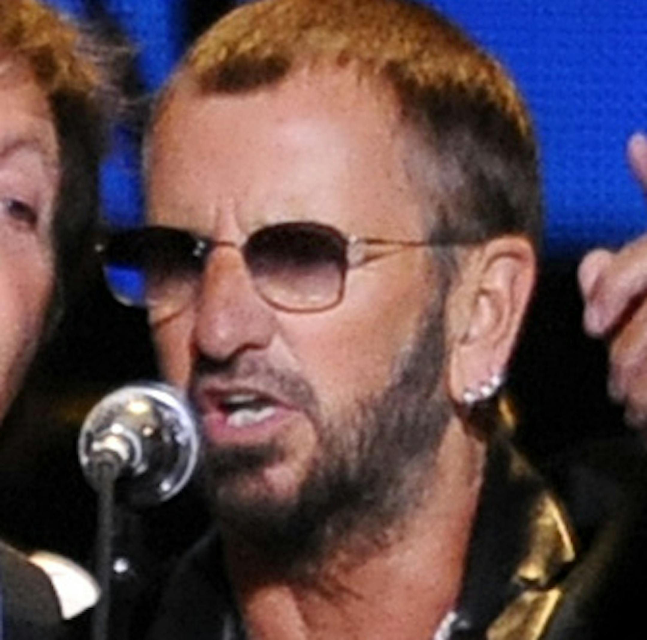 FILE - This April 4, 2009 file photo shows Paul McCartney, left, and Ringo Starr performing at the Change Begins Within Concert in New York. The Recording Academy announced Tuesday, Jan 14, 2014, that both McCartney and Starr will perform at the Jan. 26 Grammy awards show. The Beatles will be honored at the Academyís Special Merits Awards a day before, and a day after the big show, the iconic group will be the center of a performance special featuring Eurythmics and other acts playing Beatl