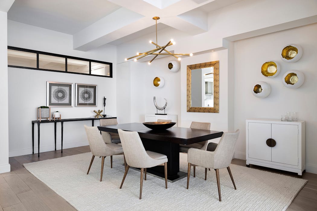 Three-dimensional sculptural art creates instant glam in this dining room.