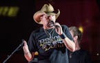 FILE - In this June 7, 2017 file photo Jason Aldean performs during a surprise pop up concert at the Music City Center in Nashville, Tenn. &#x201c;Sat