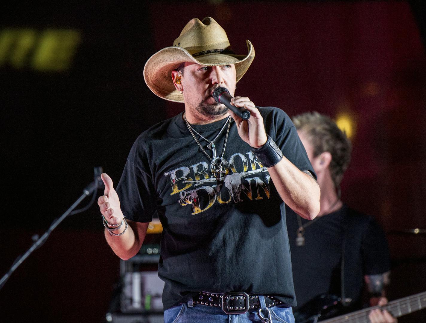 FILE - In this June 7, 2017 file photo Jason Aldean performs during a surprise pop up concert at the Music City Center in Nashville, Tenn. &#x201c;Saturday Night Live&#x201d; has paid tribute to the victims of the Las Vegas mass shooting and the late rock superstar Tom Petty by opening its show with country star Aldean singing one of Petty&#x2019;s songs. Aldean was performing at an outdoor concert in Las Vegas on Sunday, Oct. 1, 2017, when a gunman sprayed bullets into the crowd from a high-ris