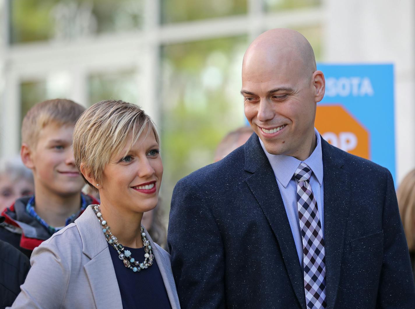 In this file photo, Angel and Carl Larsen, owners and founders of Telescope Media Group, stand in front of family and friends outside the Federal Courthouse in Saint Paul on Tuesday, October 16, 2018.