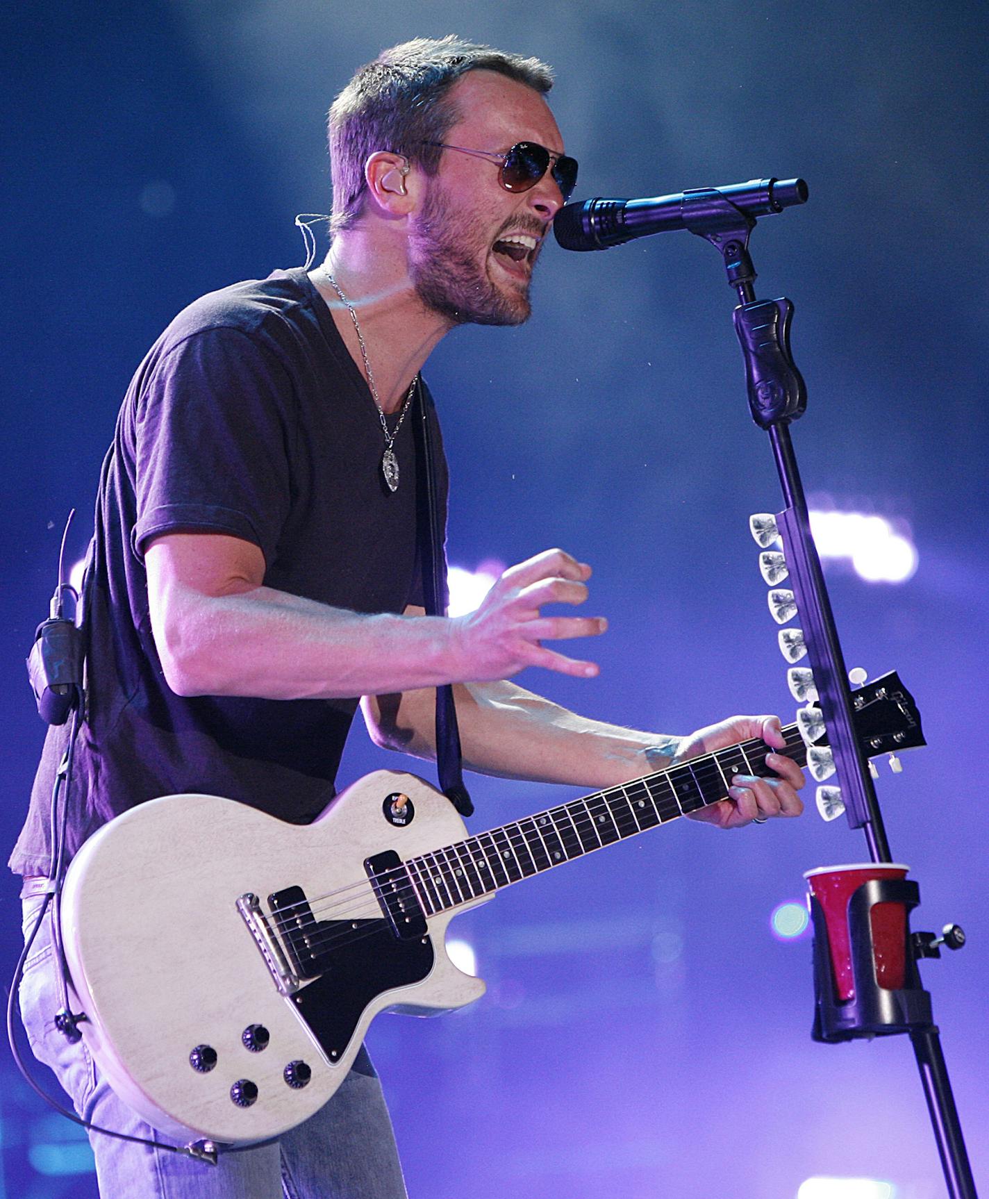 FILE - In this June 6, 2014 file photo, Eric Church performs during the CMA Fest at LP Field in Nashville, Tenn. Nominees for the 2014 Country Music Association Awards are announced Wednesday morning, Sept. 3, 2014, on "Good Morning America" and at a news conference in New York. Church and Keith Urban received four nominations each. (Photo by Wade Payne/Invision/AP, file)