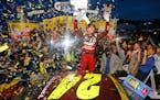 Jeff Gordon celebrates after winning the NASCAR Sprint Cup Series auto race at Martinsville Speedway in Martinsville, Va., Sunday, Nov. 1, 2015. (AP P