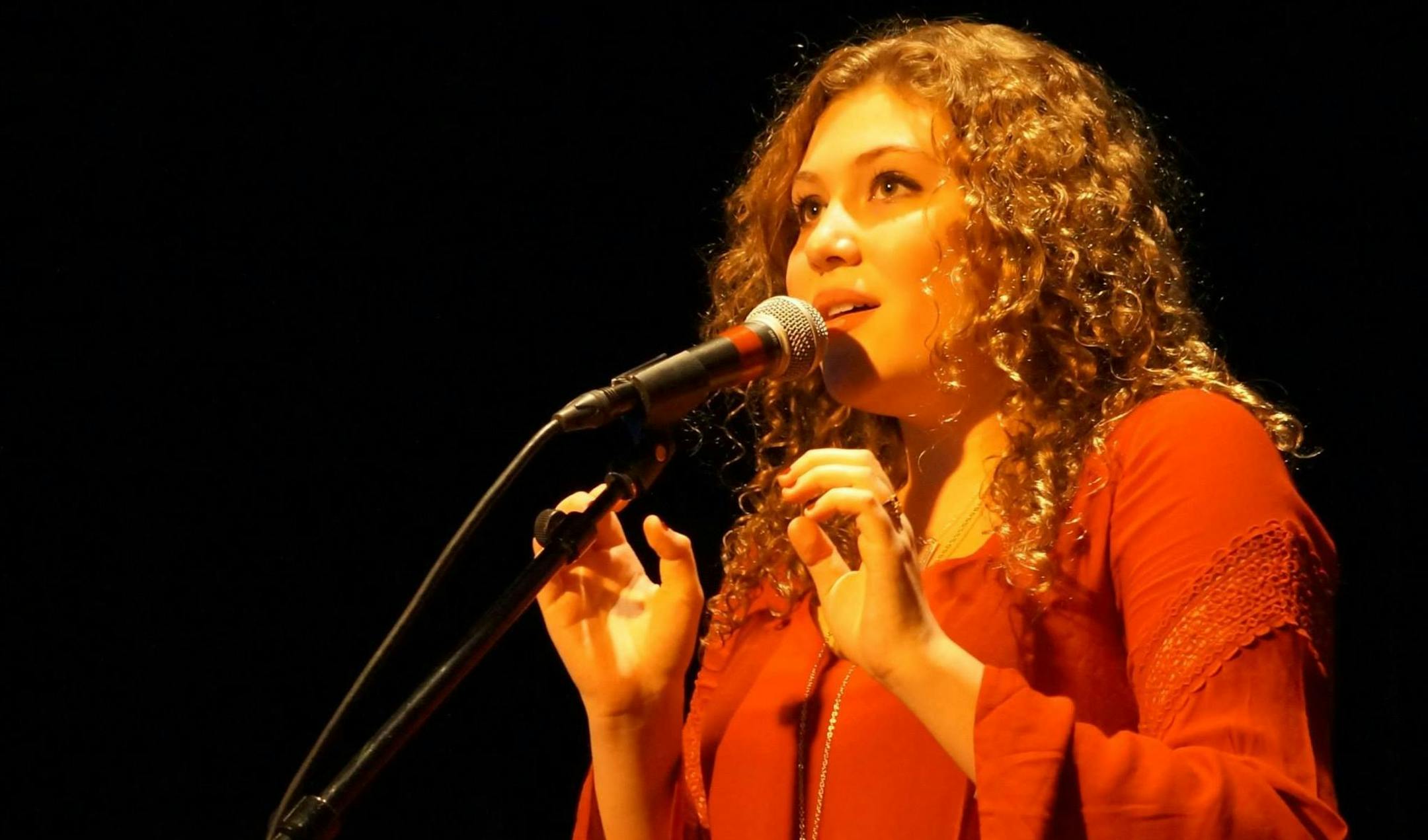 Emily Albert-Stauning performs during a benefit concert she organized at Shamrock's in St. Paul. ORG XMIT: f-02bcAhMlx-9qY_jgv8