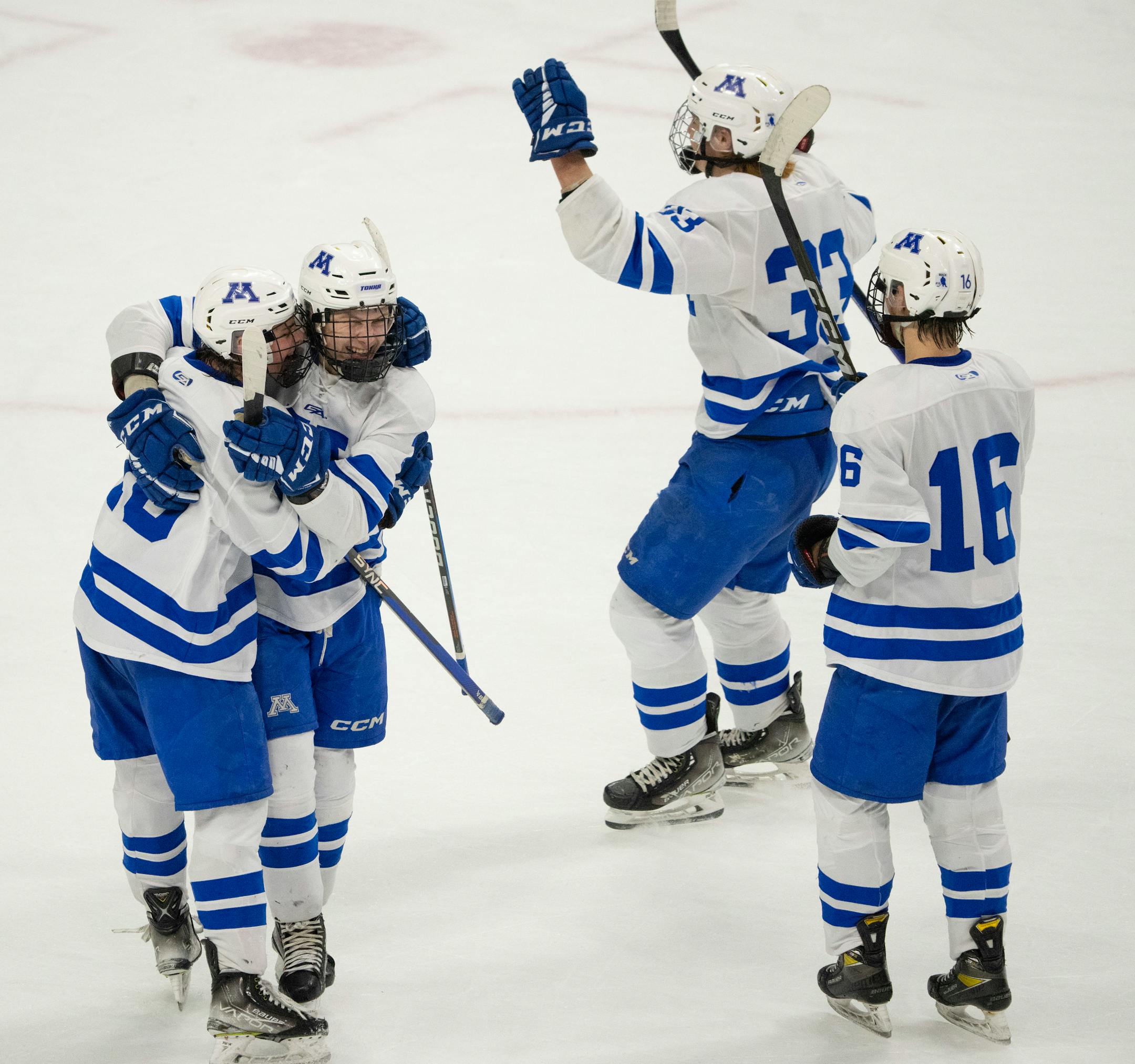 Minnetonka Skippers forward Luke Garry (10), left, congratulated Minnetonka Skippers defenseman John Stout (23) on his game winning goal in overtime.