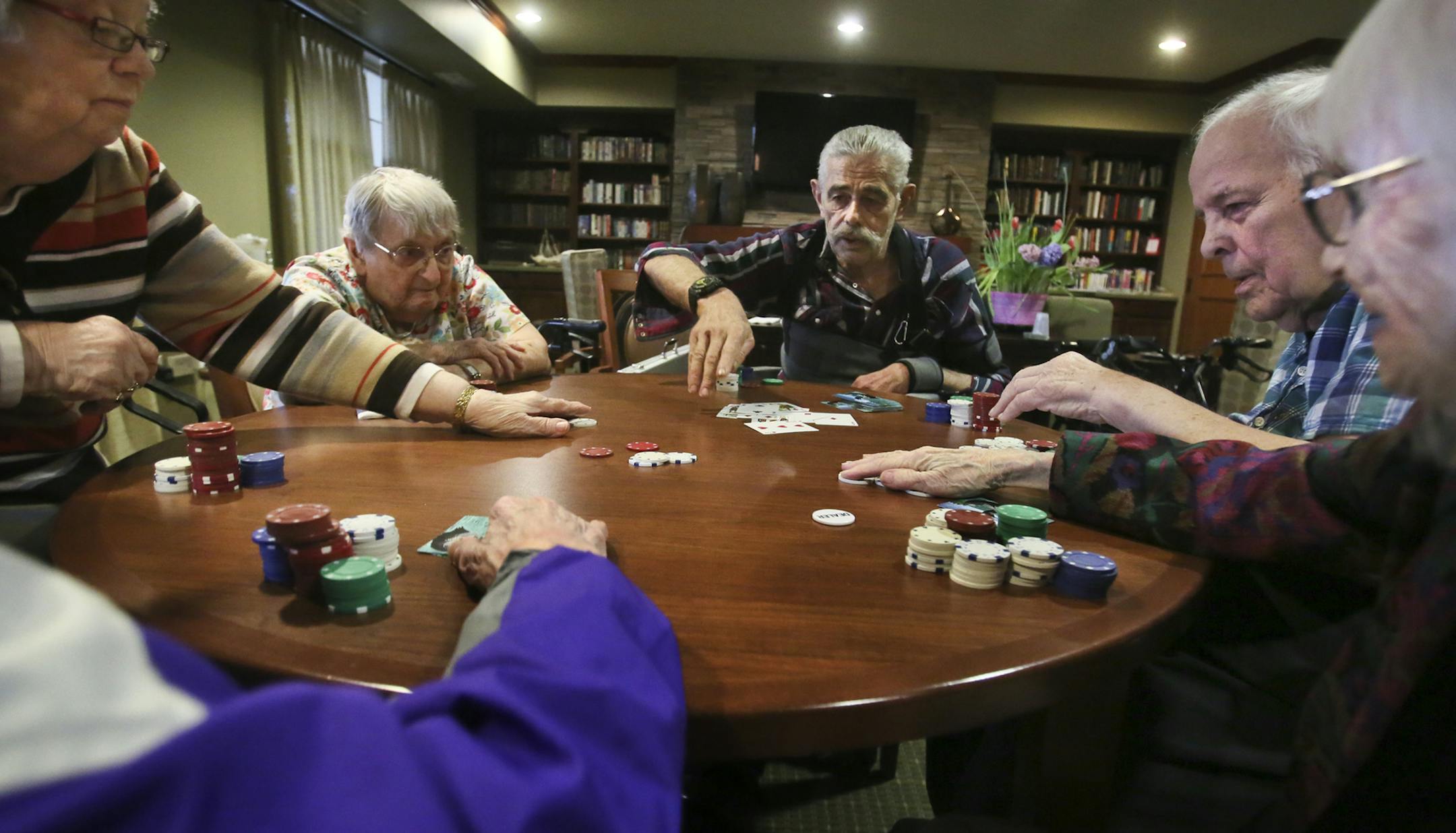 Minnehaha Senior Living residents Maurice Shaw, partially visible lower left clockwise, Clarice Jepson, Shirley Schoenike, Peter Martin, Gordy Parker and Jennie Berlovitz sit down for a game of Texas Hold 'em at Minnehaha Senior Living Tuesday, April 8, 2014, in Minneapolis, MN.](DAVID JOLES/STARTRIBUNE) djoles@startribune.com Minneapolis is striving to build at least one new senior housing complex per ward by 2025, as part of its efforts to retain and grow the city's population. Experts say tha