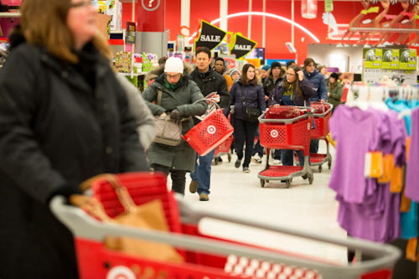 Thanksgiving night shoppers make their way through Super Target shortly after its opening. ] AARON LAVINSKY &#x2022; aaron.lavinsky@startribune.com Black Friday got an earlier kick off this year on Thanksgiving Day. Shoppers lined up early to be the first to get big deals on their holiday shopping at Target in Roseville Thursday, Nov. 27, 2014.