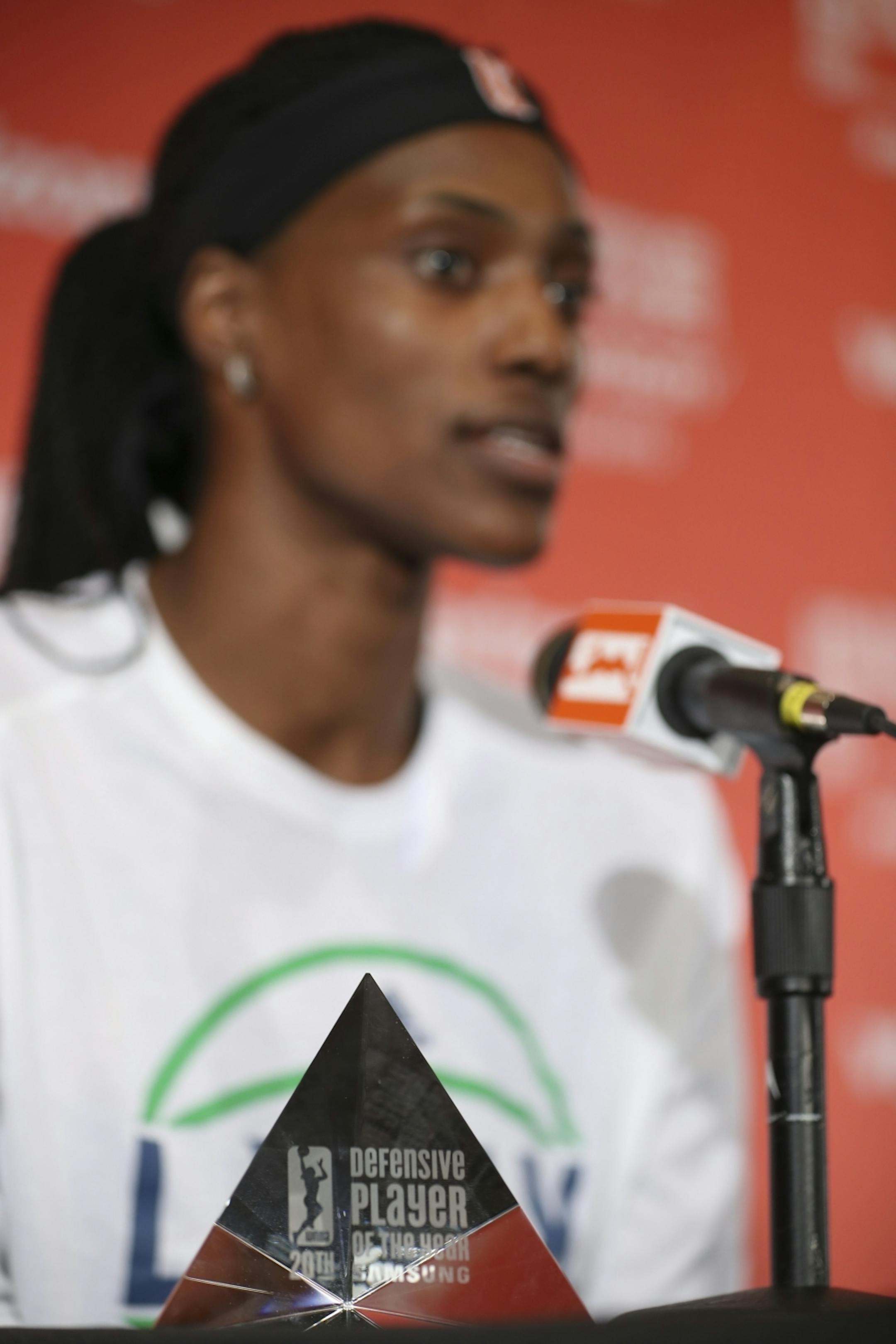Sylvia Fowles her Defensive Player of the Year trophy during a news conference before Friday night's game.