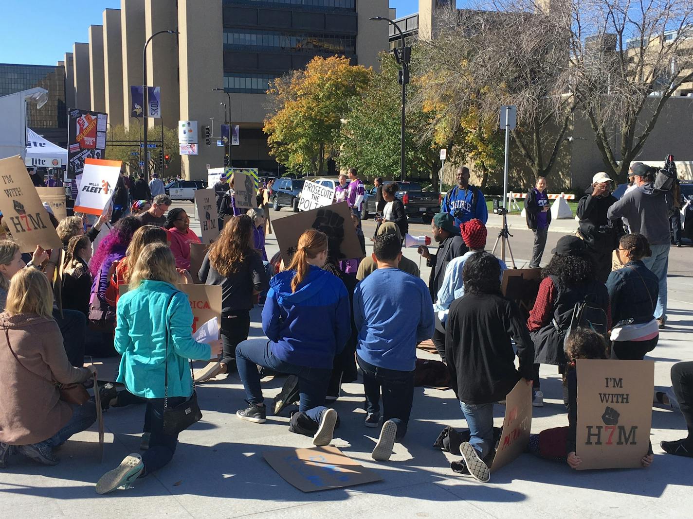 About 50 people protested police violence and kneeled during the national anthem outside of U.S. Bank Stadium ahead of Sunday's game.