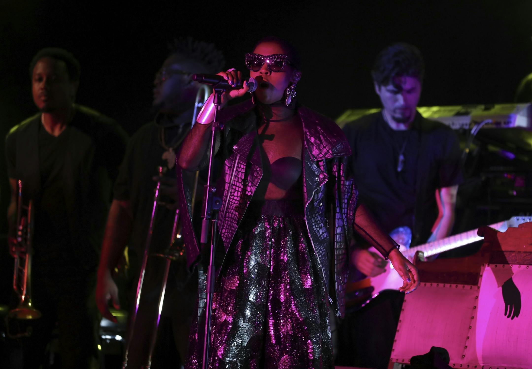 Lauryn Hill on the First Ave. stage with her band early in her set Sunday night.