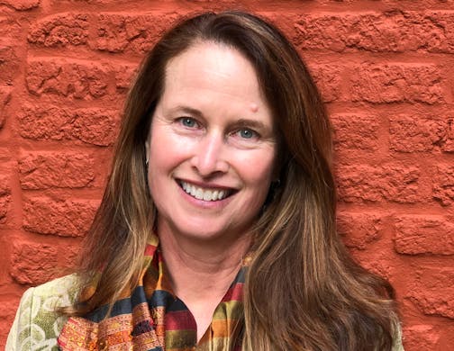 photo of author Janet Rich Edwards in front of brick wall