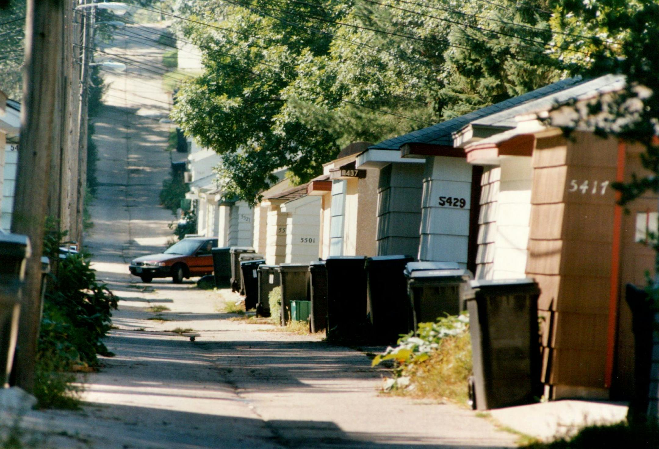 September 10, 1994 When few families owned one automobile &#x2014; let alone several-single-bay garages along alleys were the norm. As automobiles have become more plentiful, garages have grown larger and have migrated from the back yard (new developments almost never have alleys) to the front yard. Land developer Bob Engstrom, lower right, believes local building regulations often stifle creative siting and design for garages. September 6, 1994 Charles Bjorgen, Minneapolis Star Tribune