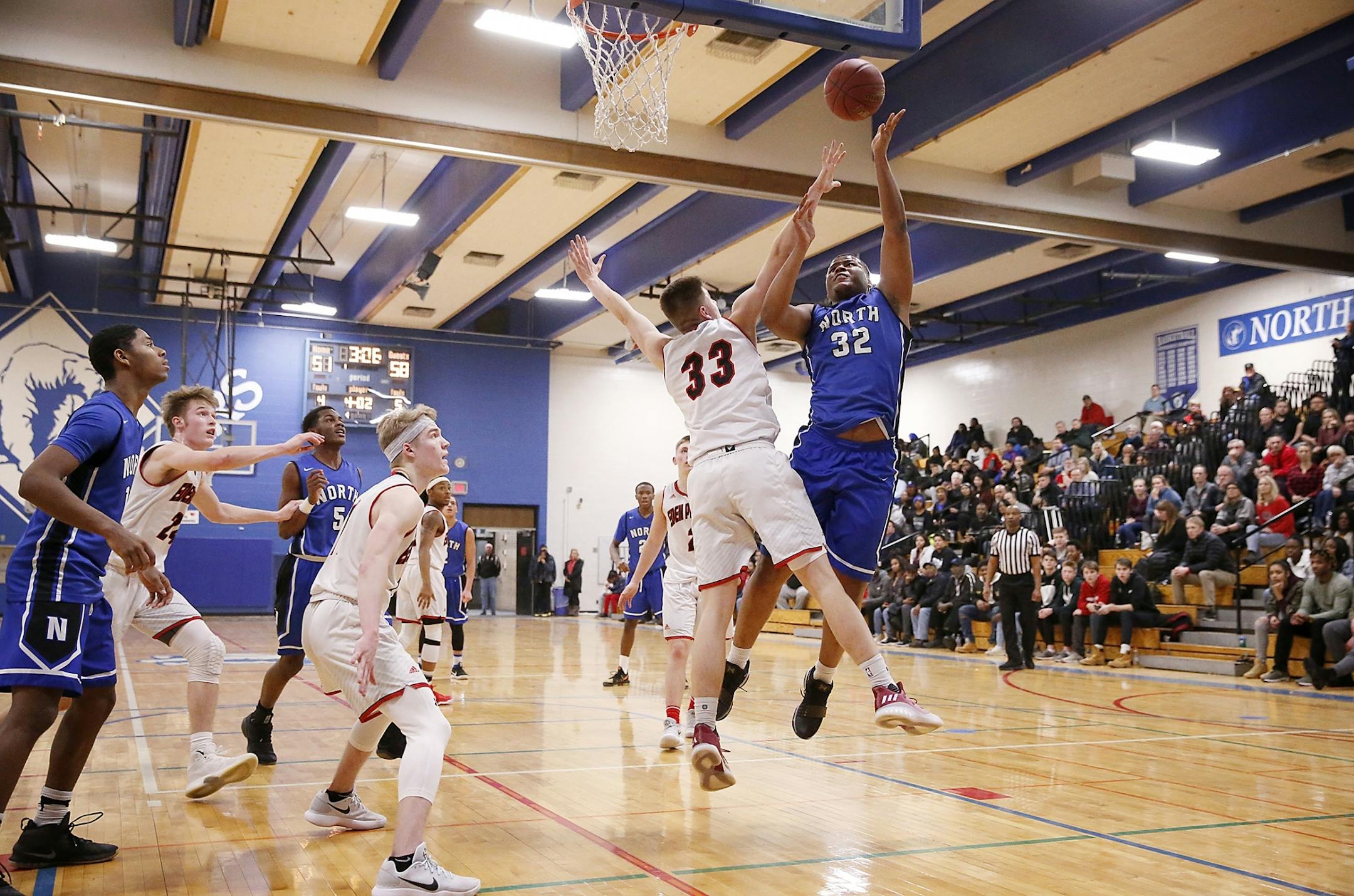 Odell Wilson IV (32) of Minneapolis North shoots against Eden Prairie in January.