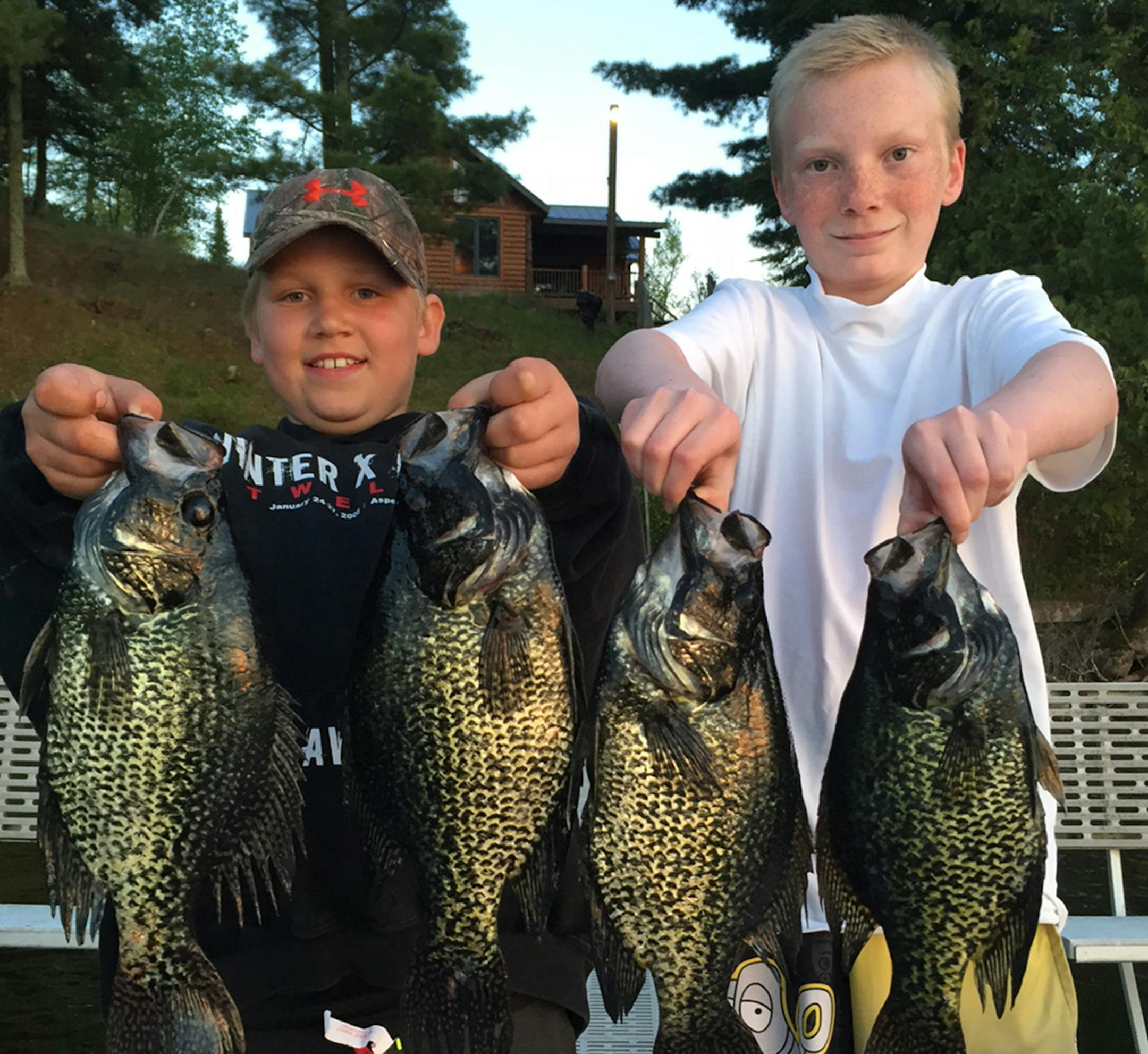 Fisher Smith, 10, Longville, on left, and Tommy McNamara, 12, Bloomington, with some big crappies they caught on Little Boy Lake.