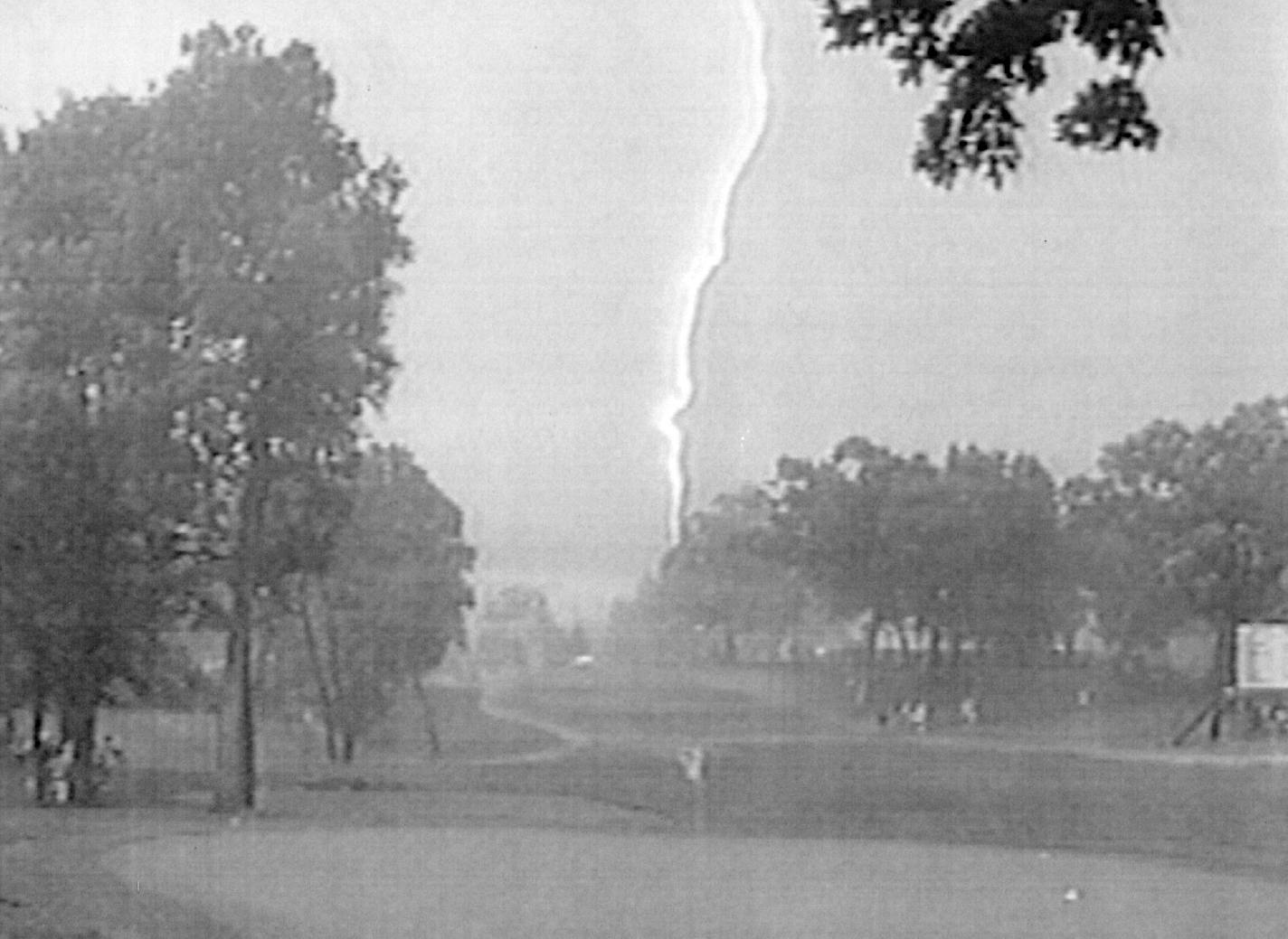 June 13, 1991 Lightning kills U.S. Open spectator — A bolt of lightning is seen in this photo taken from a television monitor over the Hazeltine National Golf Course in Cheska, Minn., Thursday, where lightning killed one spectator at the U.S. Open golf tournament and injured five others seeking shelter under the same tree. The fatal bolt struck near the 11th tee about 10 minutes after play was suspended because of the storm. June 14, 1991 AP Laserphoto ORG XMIT: MIN2017013010501788