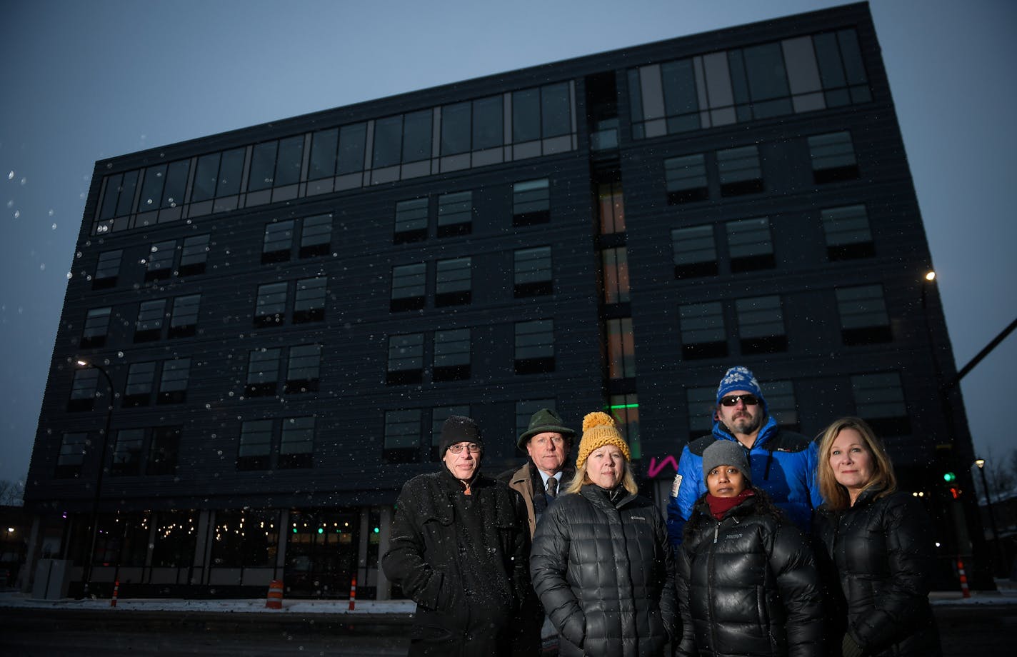 From left, Robert Morris, Phillip Qualy, Paula Johnson, Billy Davis, Nazeera Mohammed and Ginny Buran, concerned neighbors of the Moxy in Uptown, stood for a portrait in front of the hotel Wednesday afternoon. ] AARON LAVINSKY &#x2022; aaron.lavinsky@startribune.com The developers of the Moxy, the new hotel in Uptown, assured the neighborhood they were planning to build a family-friendly hotel where people's visiting grandparents could stay. But the hotel website has videos and photos promoting