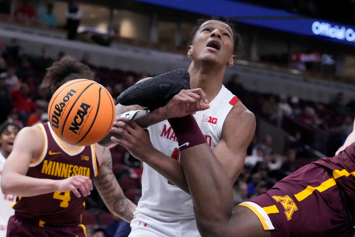 Maryland's Julian Reese is fouled by Minnesota's Pharrel Payne during the second half of an NCAA college basketball game at the Big Ten men's tournament, Thursday, March 9, 2023, in Chicago. Maryland won 70-54. (AP Photo/Charles Rex Arbogast)