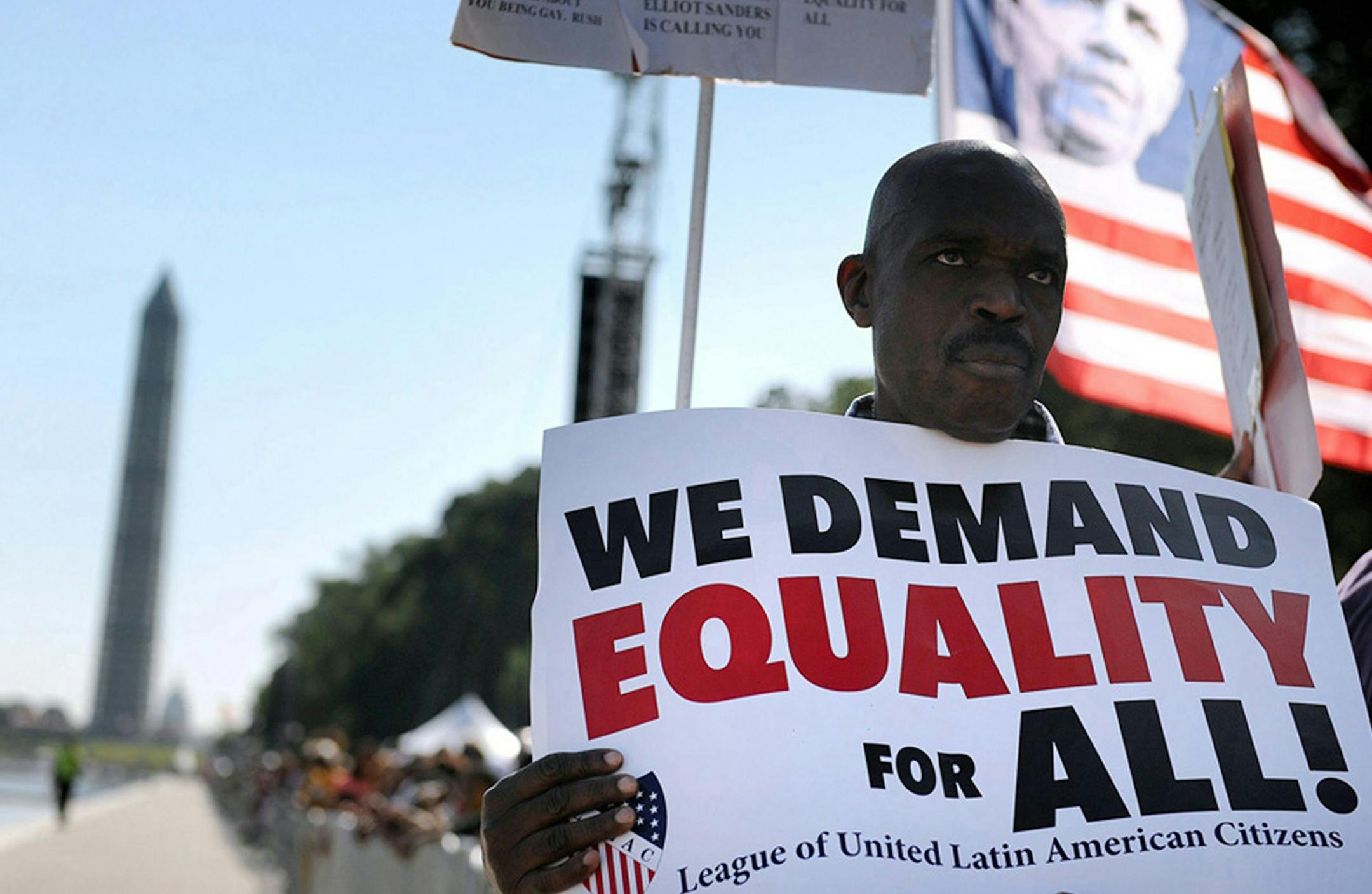 People listen to speakers during the 50th anniversary of the March on Washington and Dr. Martin Luther King Jr.'s "I have a Dream" speech at the Lincoln Memorial in Washington, D.C., Saturday, August 24, 2013. ORG XMIT: MIN1308241518186390
