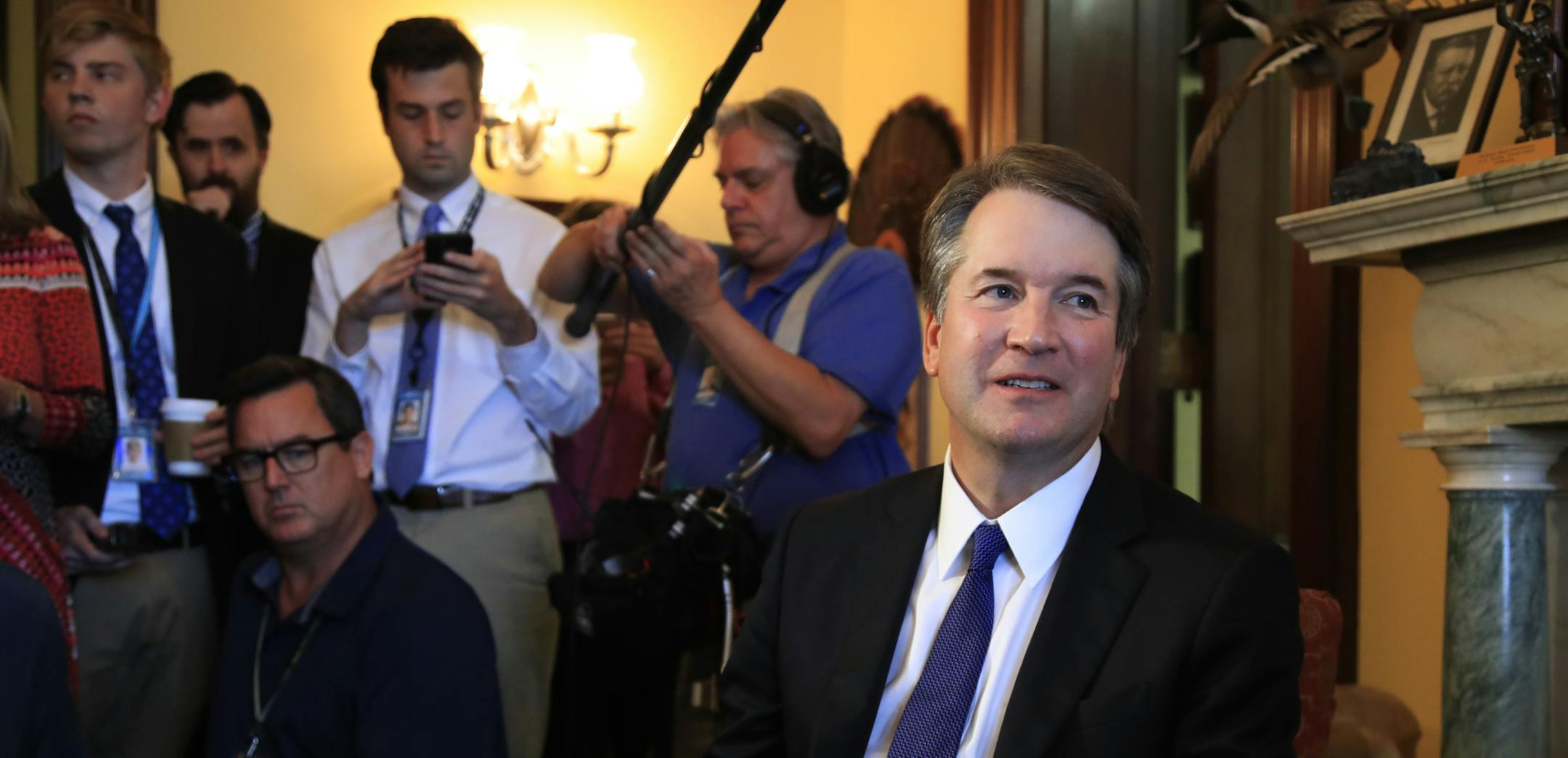 Supreme Court nominee Brett Kavanaugh listens to Sen. Rob Portman, R-Ohio, on Capitol Hill in Washington, during a meeting Wednesday, July 11, 2018. (AP Photo/Manuel Balce Ceneta)
